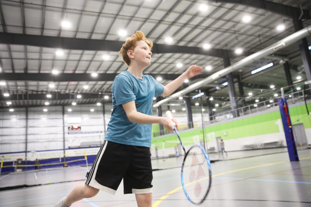 Child playing badminton