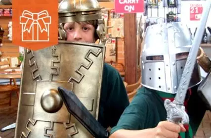 boys dressed up in armour in museum gift shop